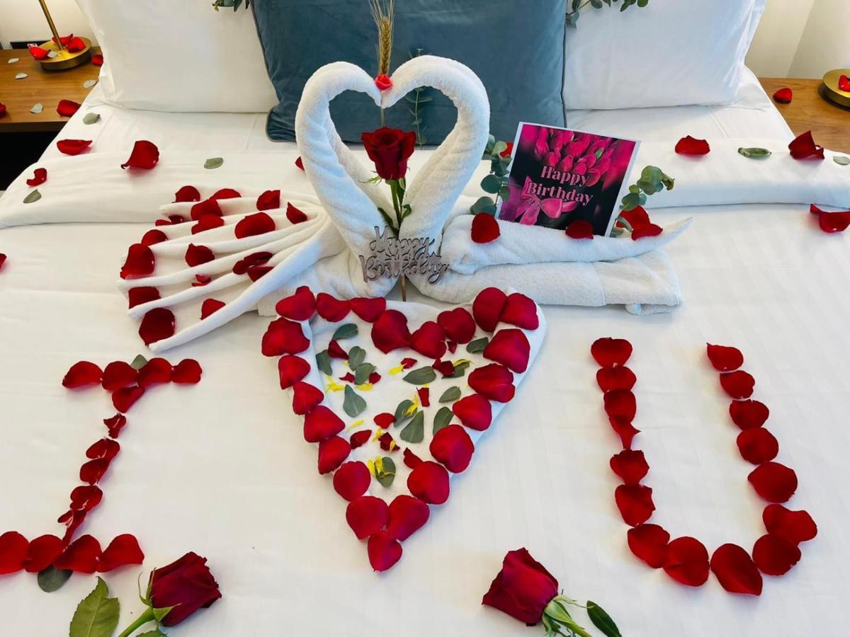 Cielo Hotel Lusail Qatar Exterior photo A bed decorated for a romantic night